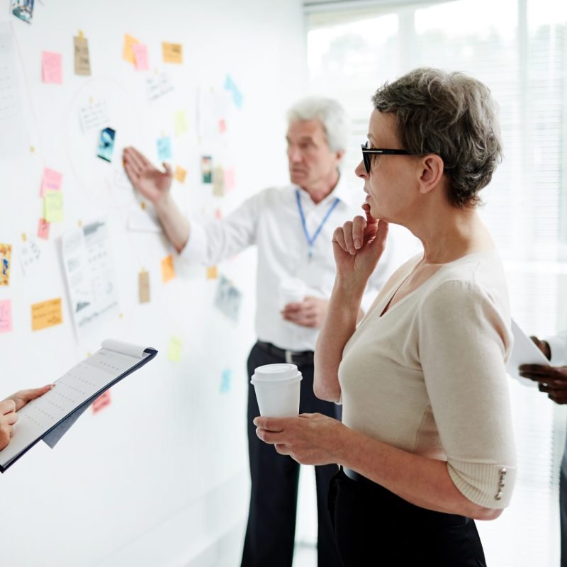 Pensive investigator looking at evidence of air crash in working environment